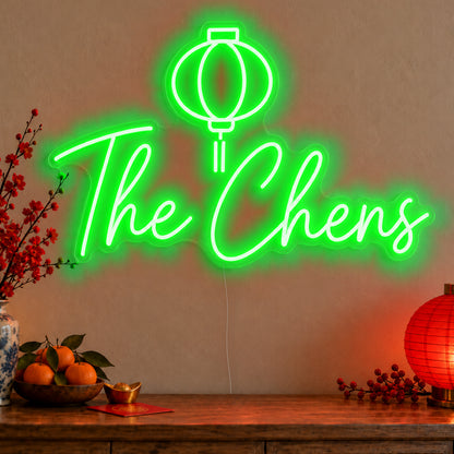 Personalised Family Lantern Neon Sign in green LED neon on clear acrylic, angled view