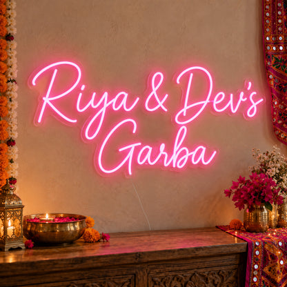 Personalised Garba Neon Sign on clear cut-to-shape acrylic, illuminated on a wall in a styled celebration setting; sample personalised wording shown