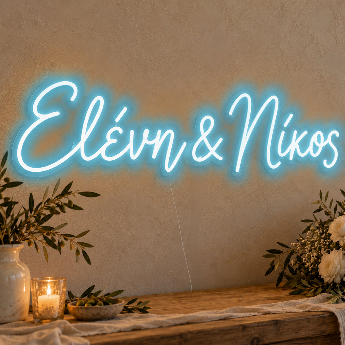 Personalised Greek Couple Names Neon Sign in ice blue LED neon on clear acrylic, angled view