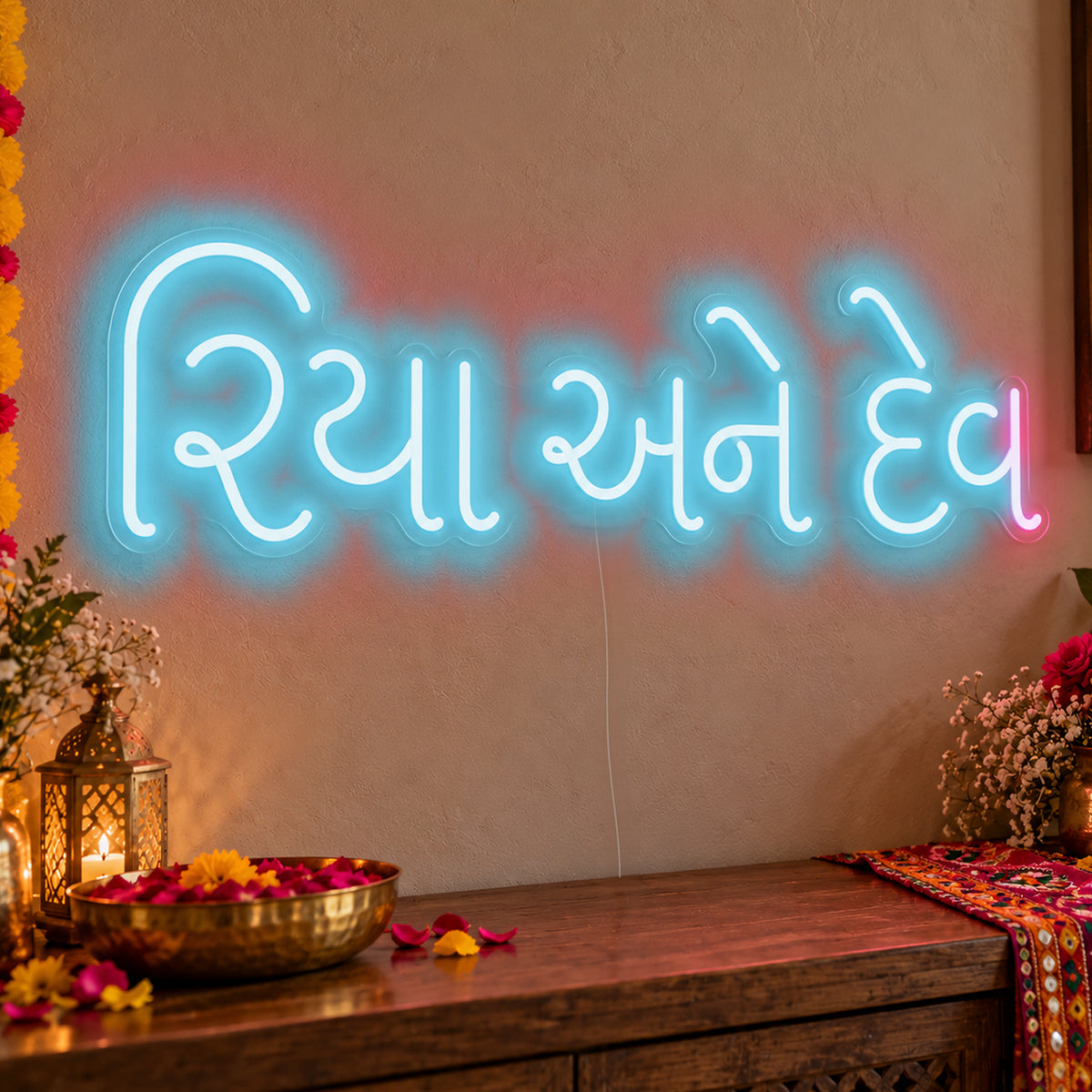 Personalised Gujarati Couple Names Neon Sign in ice blue LED neon on clear acrylic, angled view