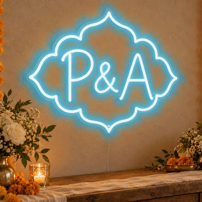Personalised Marigold Initials Neon Sign in ice blue LED neon on clear acrylic, angled view
