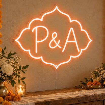 Personalised Marigold Initials Neon Sign in orange LED neon on clear acrylic, angled view