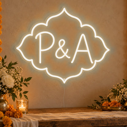Personalised Marigold Initials Neon Sign in warm white LED neon on clear acrylic, angled view