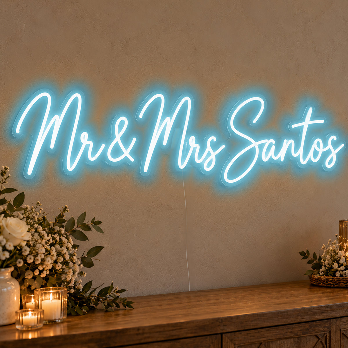 Personalised Mr & Mrs Surname Neon Sign in ice blue LED neon on clear acrylic, angled view