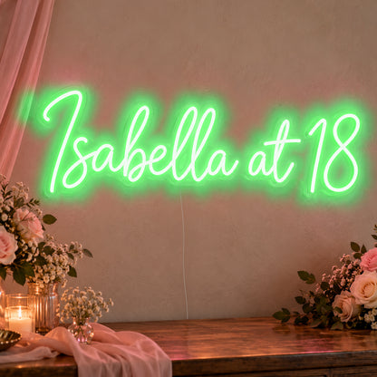 Personalised Name At 18 Neon Sign in green LED neon on clear acrylic, angled view