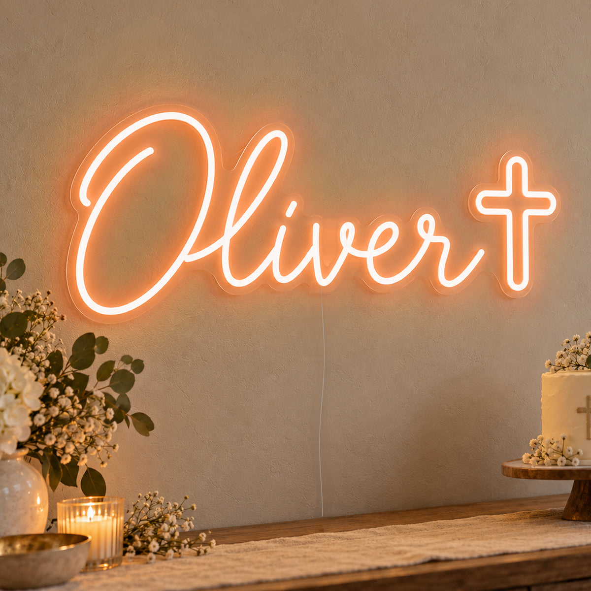 Personalised Name Cross Neon Sign in orange LED neon on clear acrylic, angled view