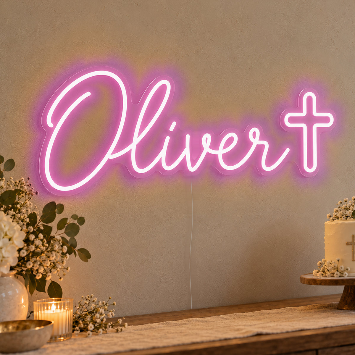 Personalised Name Cross Neon Sign in pink LED neon on clear acrylic, angled view