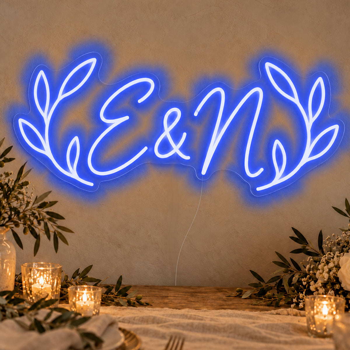 Personalised Olive Initials Neon Sign in blue LED neon on clear acrylic, angled view