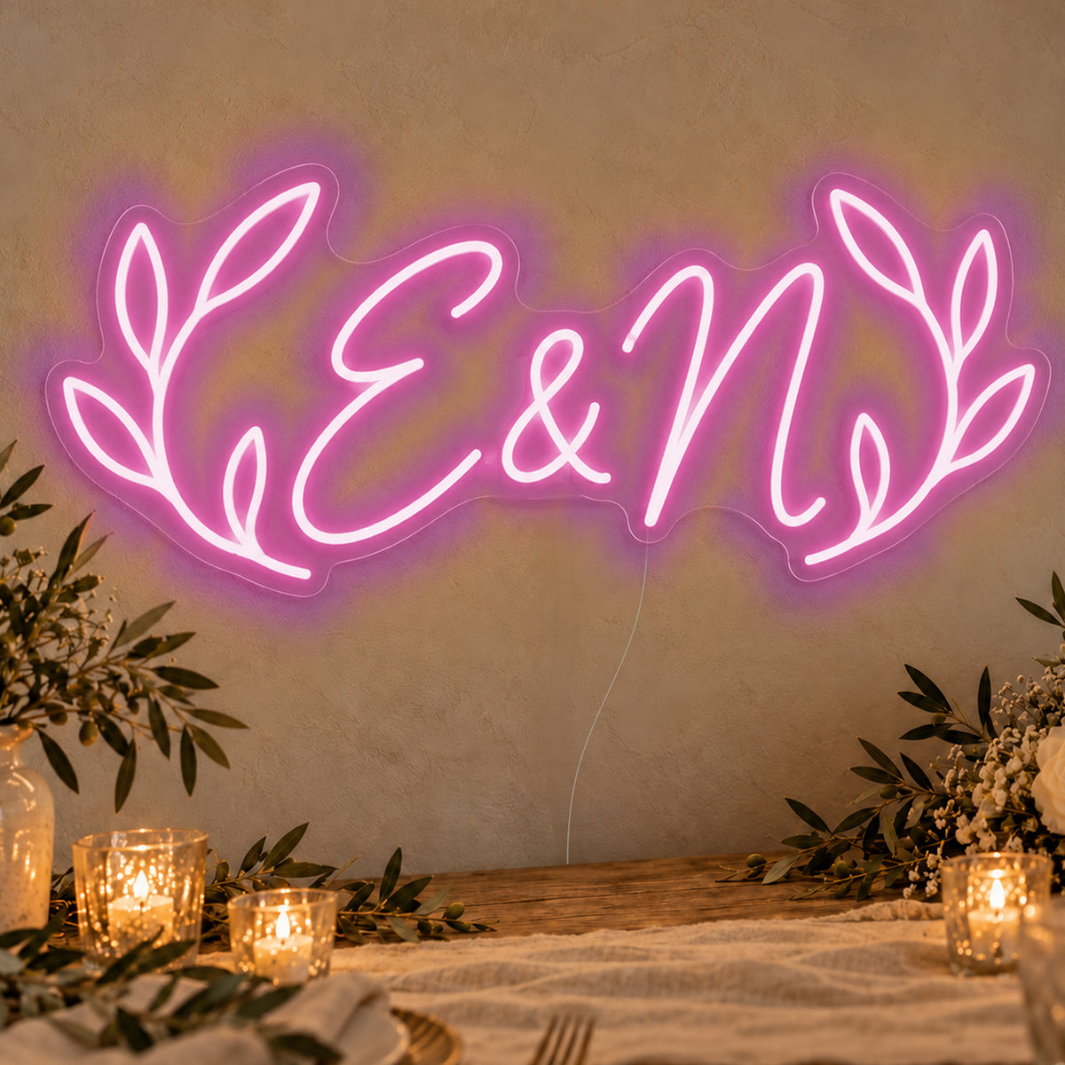 Personalised Olive Initials Neon Sign in pink LED neon on clear acrylic, angled view