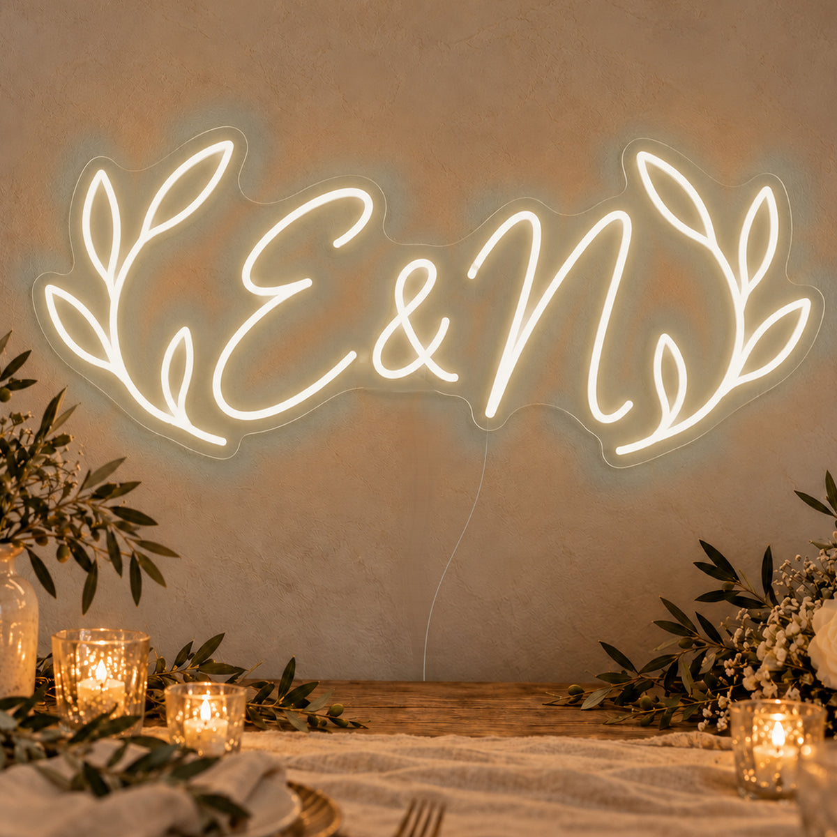 Personalised Olive Initials Neon Sign in warm white LED neon on clear acrylic, angled view