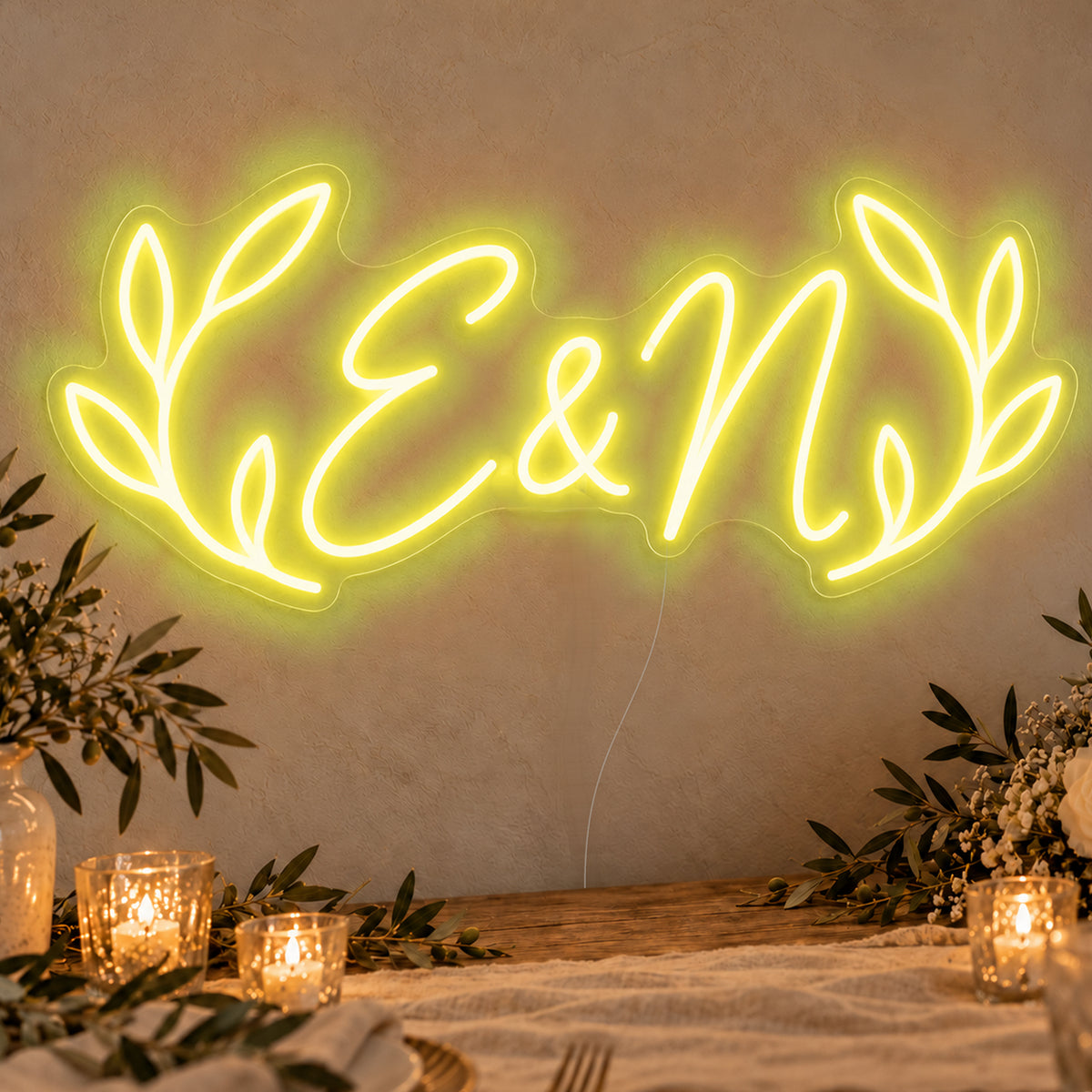 Personalised Olive Initials Neon Sign in yellow LED neon on clear acrylic, angled view