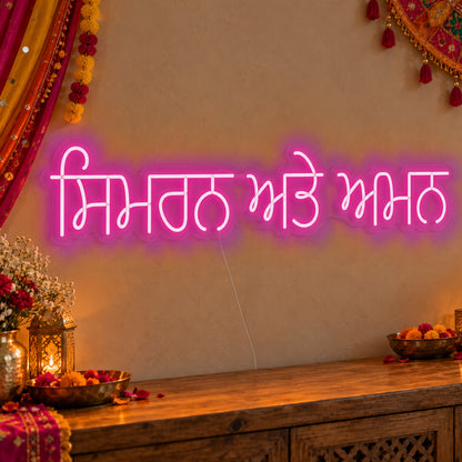 Personalised Punjabi Couple Names Neon Sign in pink LED neon on clear acrylic, angled view