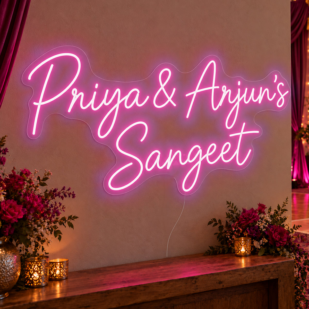 Personalised Sangeet Neon Sign in pink LED neon on clear acrylic, angled view