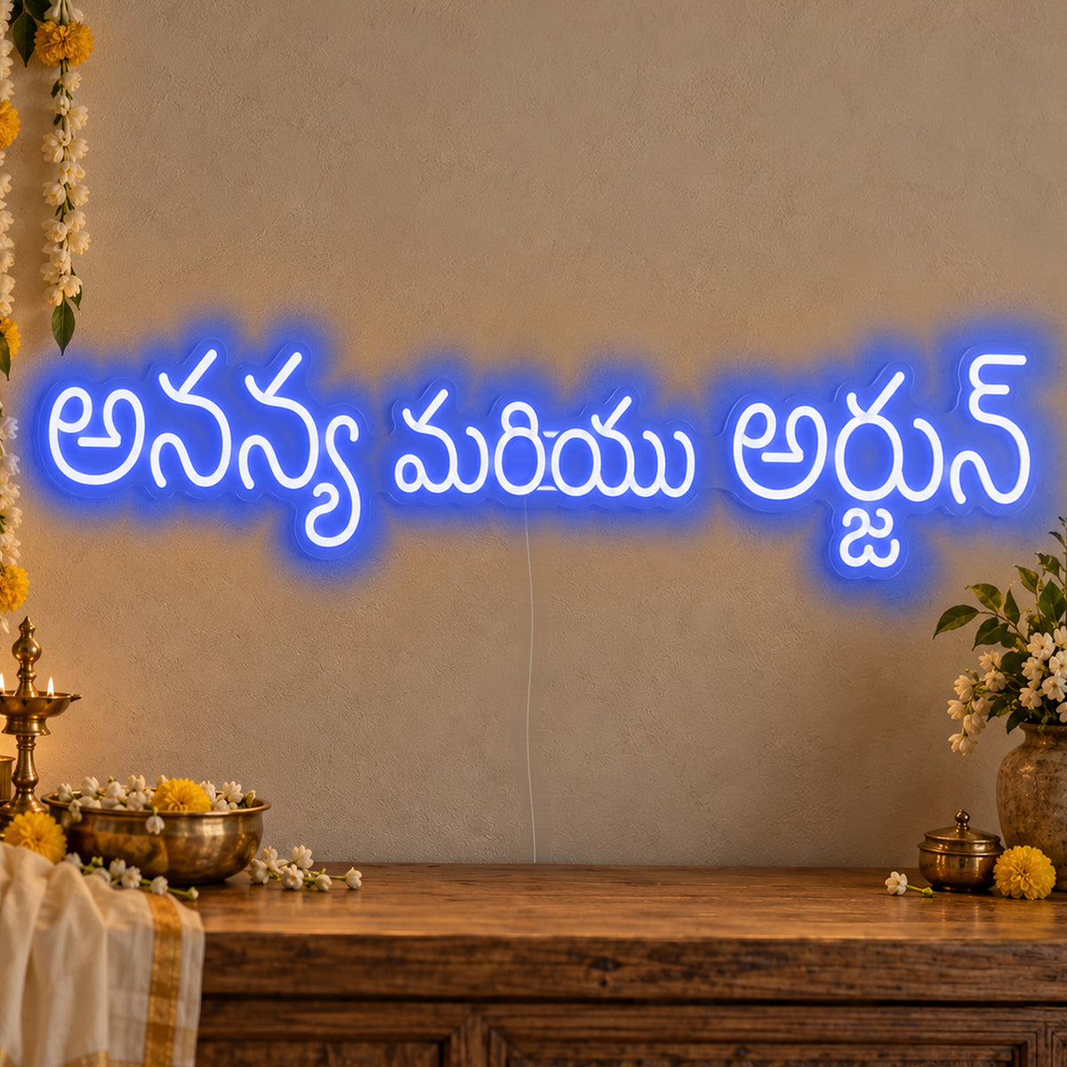 Personalised Telugu Couple Names Neon Sign in blue LED neon on clear acrylic, angled view