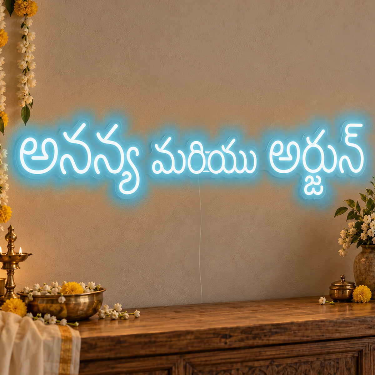 Personalised Telugu Couple Names Neon Sign in ice blue LED neon on clear acrylic, angled view
