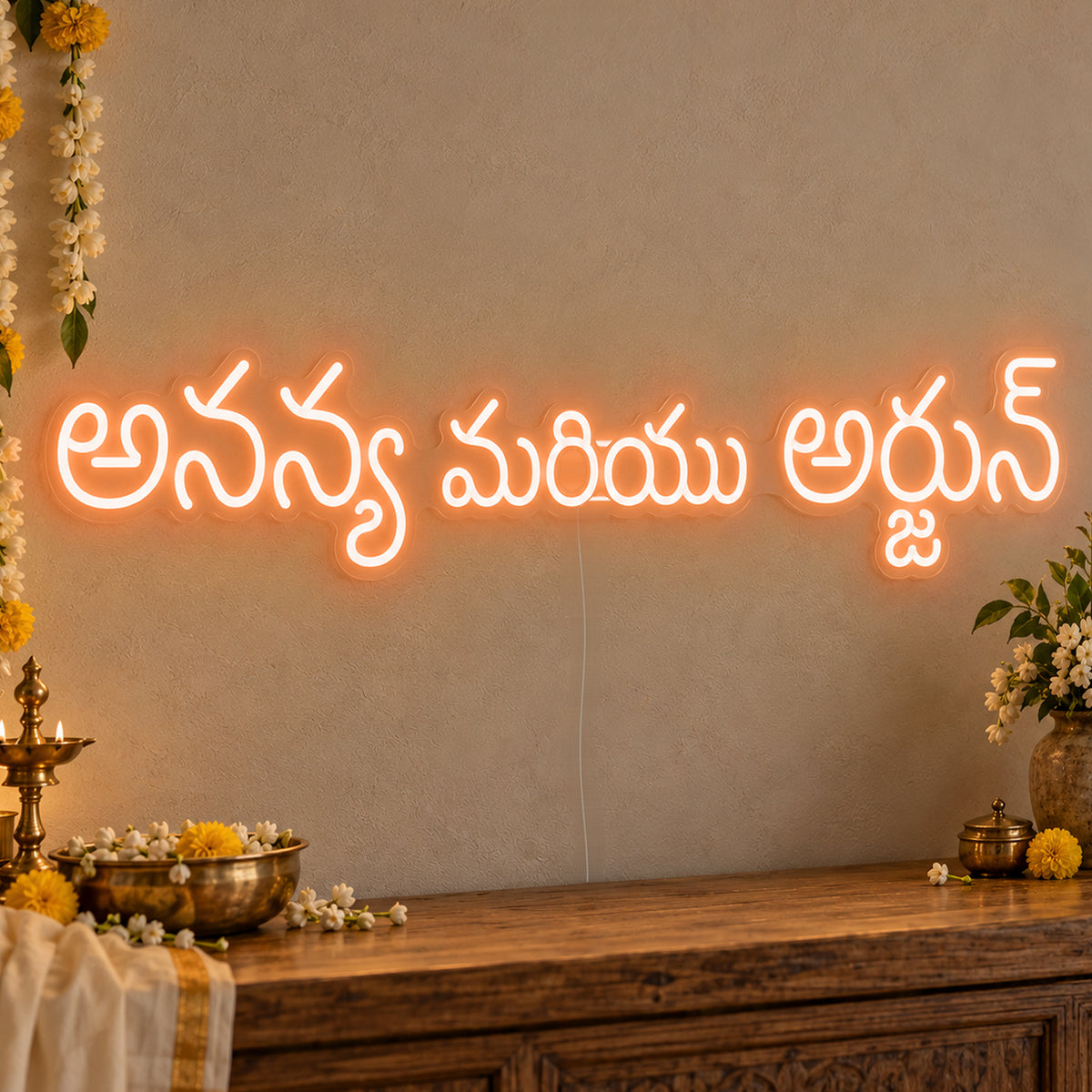 Personalised Telugu Couple Names Neon Sign in orange LED neon on clear acrylic, angled view