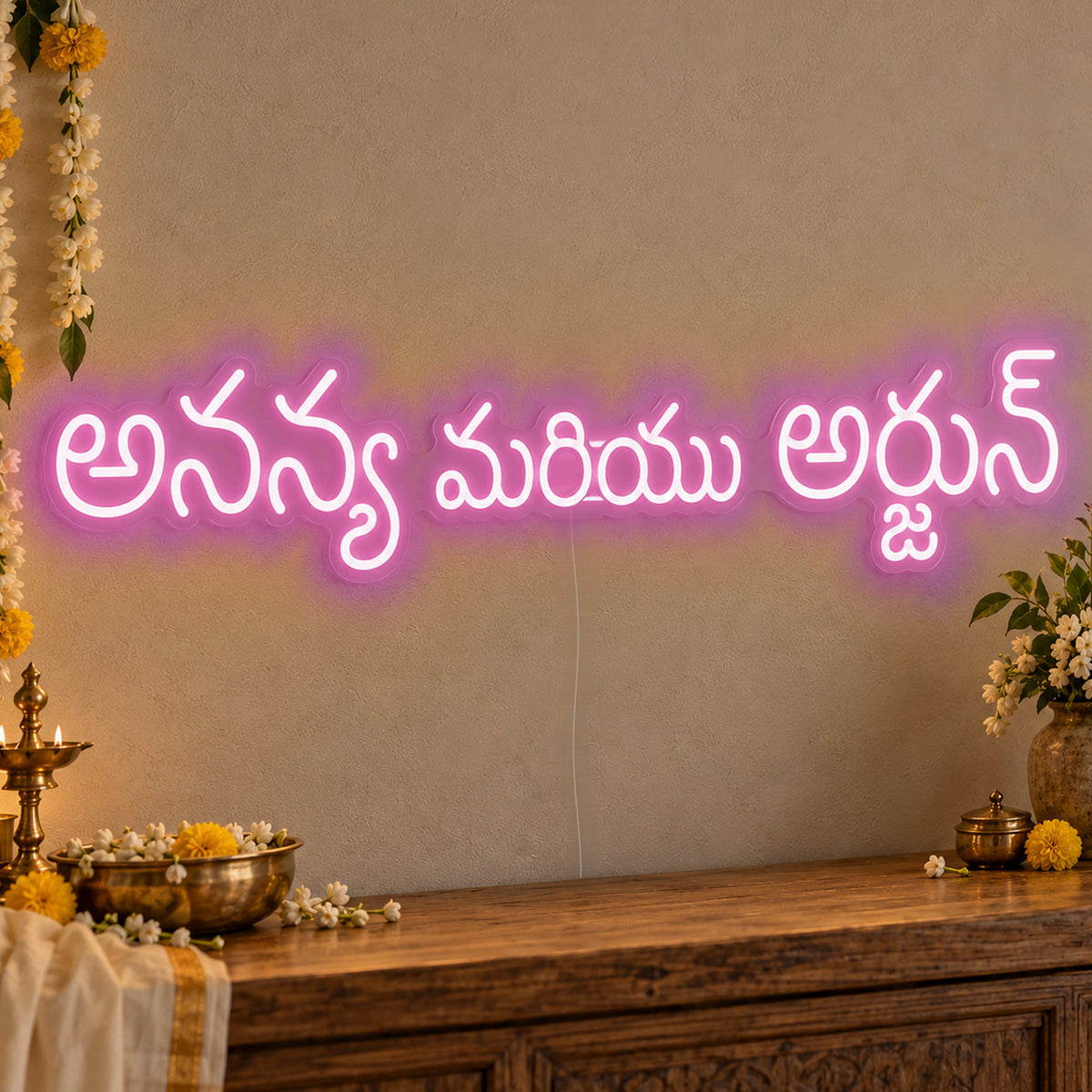 Personalised Telugu Couple Names Neon Sign in pink LED neon on clear acrylic, angled view