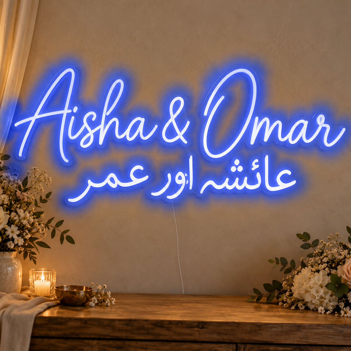 Personalised Two Script Names Neon Sign in blue LED neon on clear acrylic, angled view