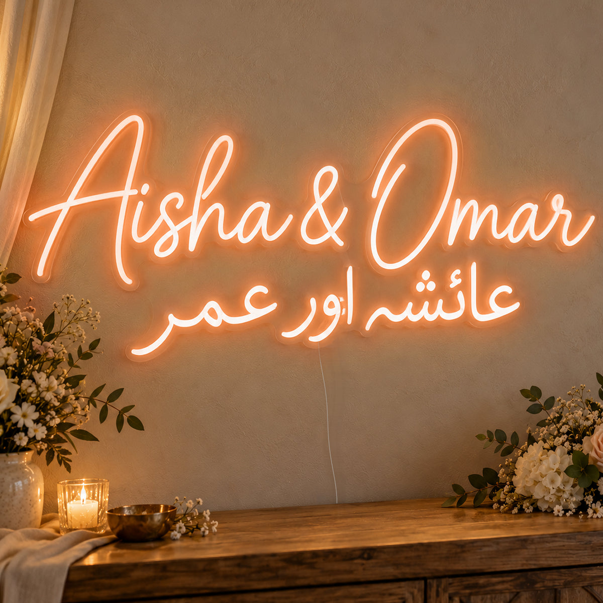 Personalised Two Script Names Neon Sign in orange LED neon on clear acrylic, angled view