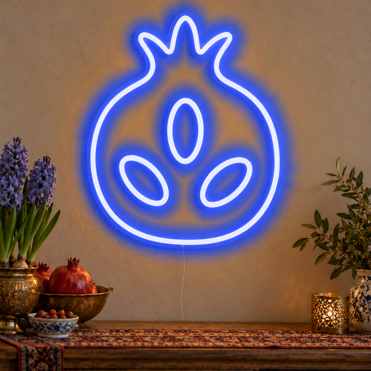 Pomegranate Neon Sign in blue LED neon on clear acrylic, angled view