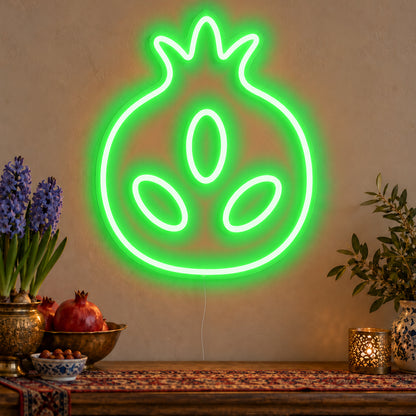 Pomegranate Neon Sign in green LED neon on clear acrylic, angled view