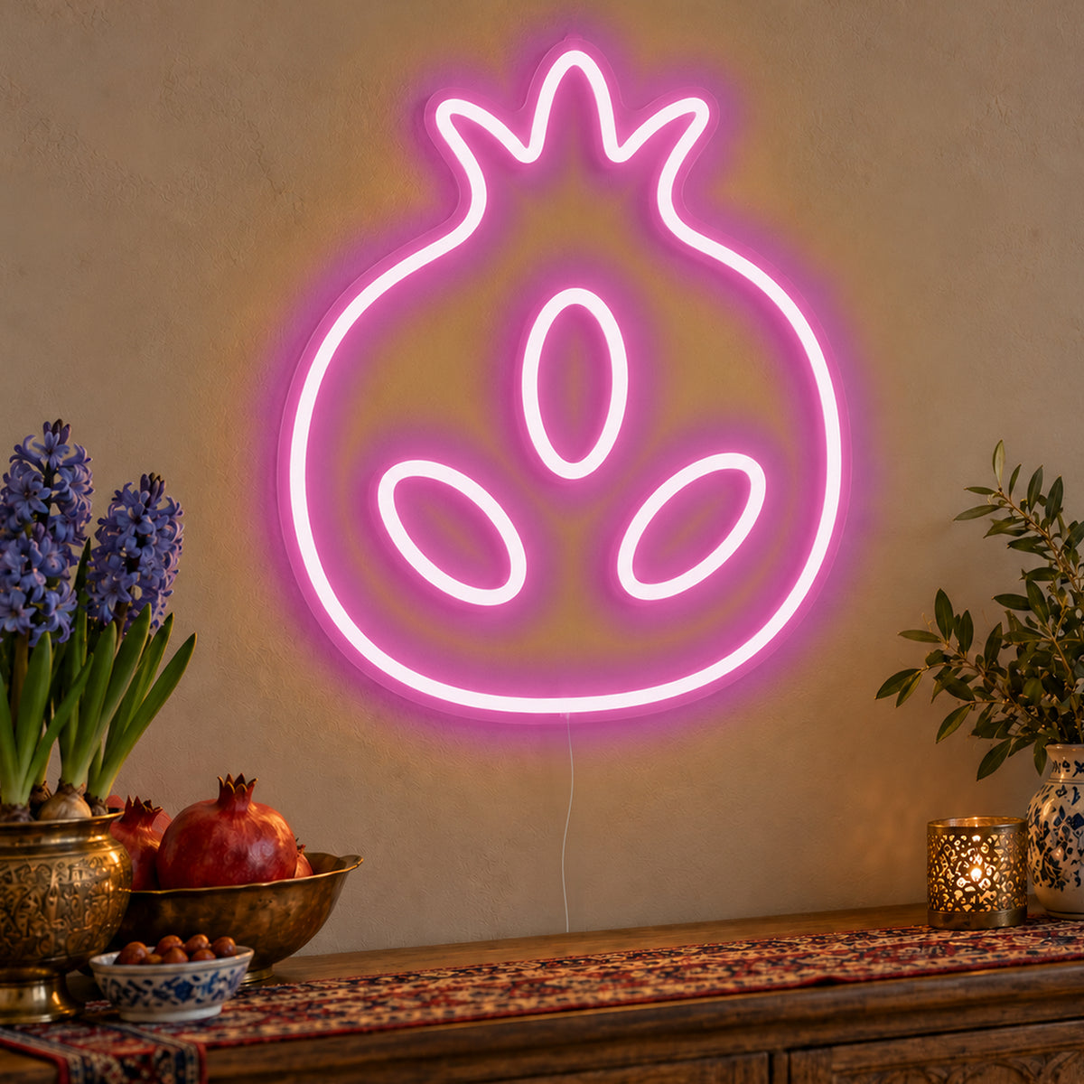 Pomegranate Neon Sign in pink LED neon on clear acrylic, angled view