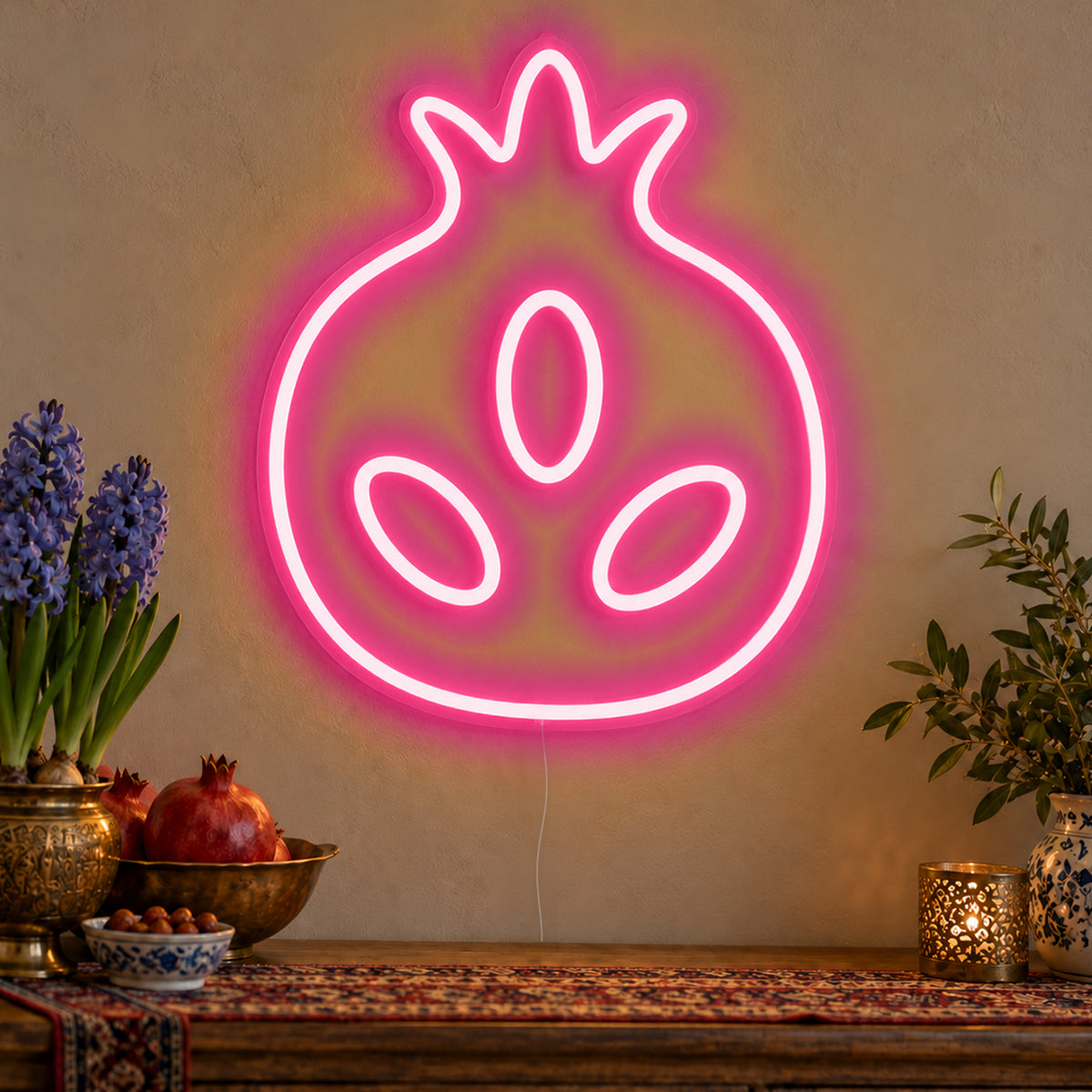 Pomegranate Neon Sign in rose red LED neon on clear acrylic, angled view