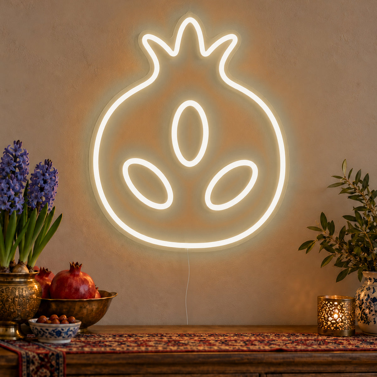 Pomegranate Neon Sign in warm white LED neon on clear acrylic, angled view