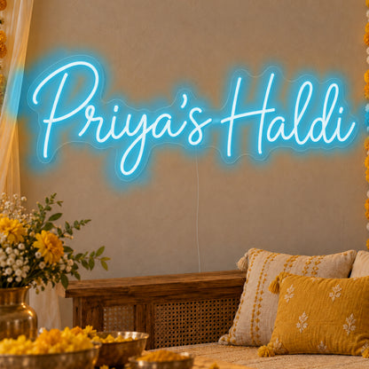 Personalised Haldi Neon Sign in ice blue LED neon on clear acrylic, angled view