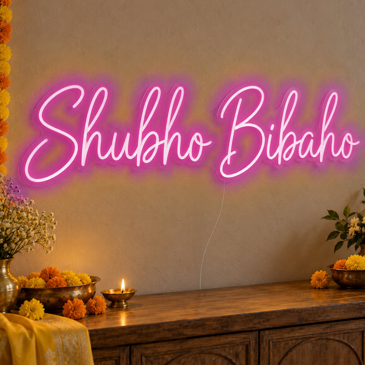 Shubho Bibaho Neon Sign in pink LED neon on clear acrylic, angled view