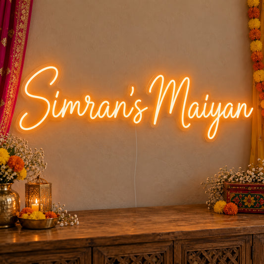 Personalised Maiyan Neon Sign on clear cut-to-shape acrylic, illuminated on a wall in a styled celebration setting; sample personalised wording shown
