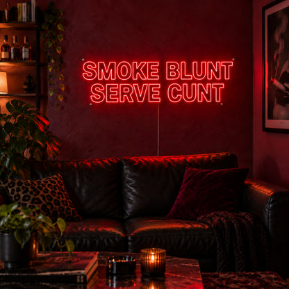Smoke Blunt Serve Cunt Neon Sign in red above a black leather sofa.