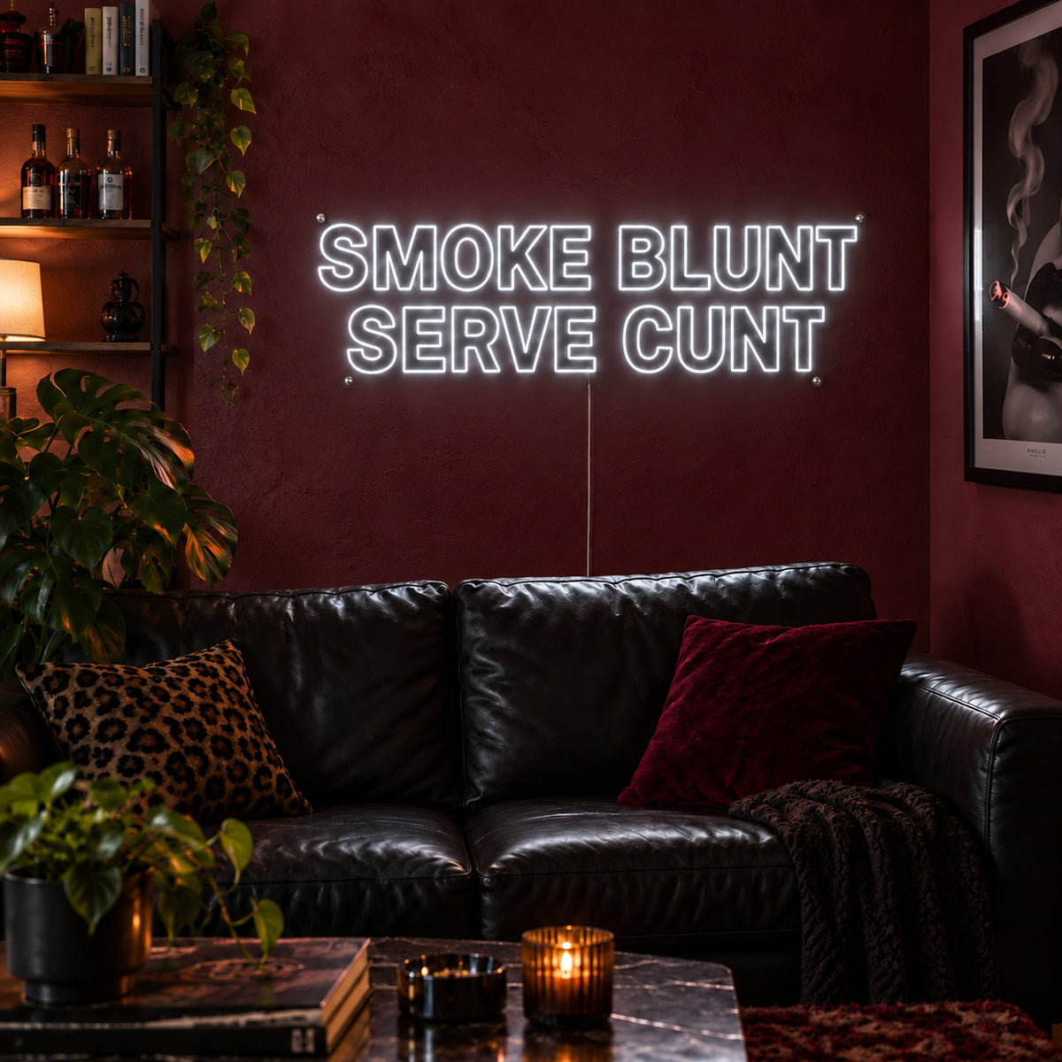 Smoke Blunt Serve Cunt Neon Sign, RGB colour-changing option shown in white above a black leather sofa.