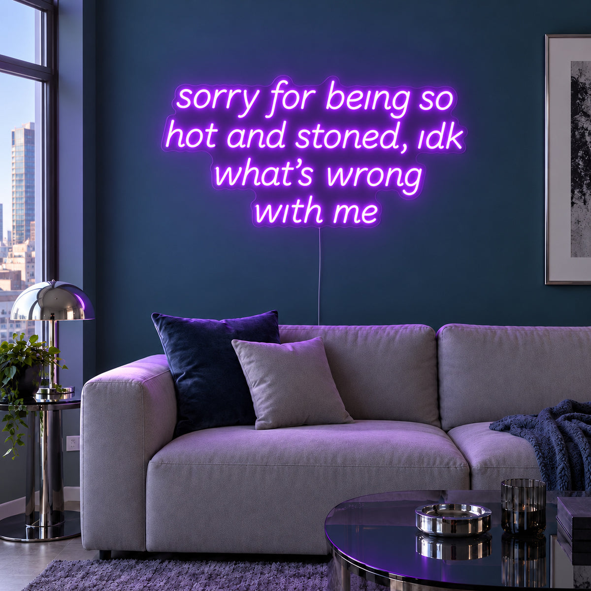 Sorry For Being So Hot And Stoned, Idk What's Wrong With Me Neon Sign with purple lighting, displayed above a grey sofa against a blue wall.