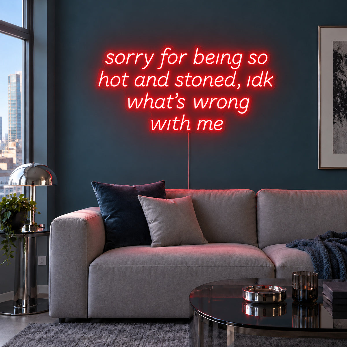 Sorry For Being So Hot And Stoned, Idk What's Wrong With Me Neon Sign with red lighting, displayed above a grey sofa against a blue wall.