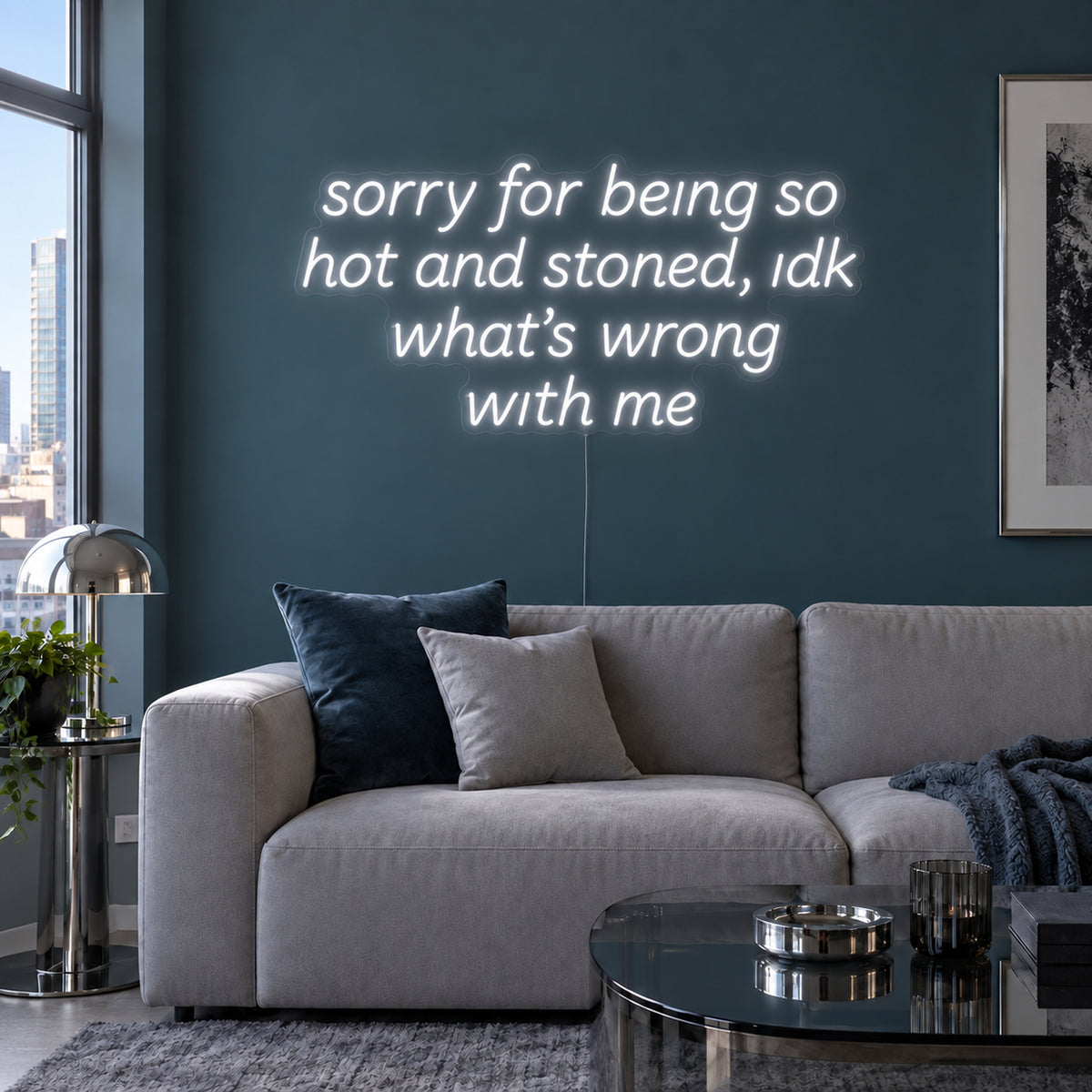 Sorry For Being So Hot And Stoned, Idk What's Wrong With Me Neon Sign, RGB colour-changing option shown in white above a grey sofa against a blue wall.