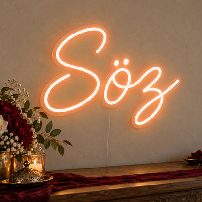 Söz Neon Sign in orange LED neon on clear acrylic, angled view