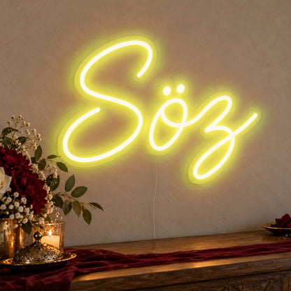 Söz Neon Sign in yellow LED neon on clear acrylic, angled view
