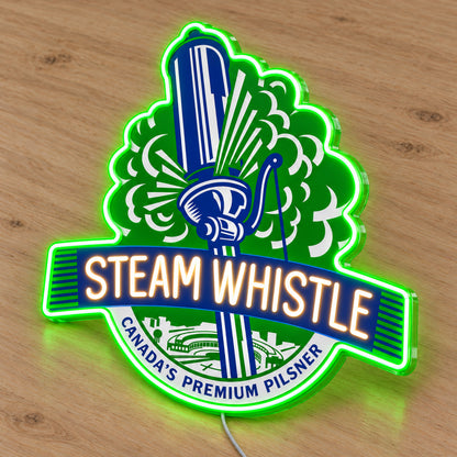 Steam Whistle LED neon sign on a light wooden surface, second angled view