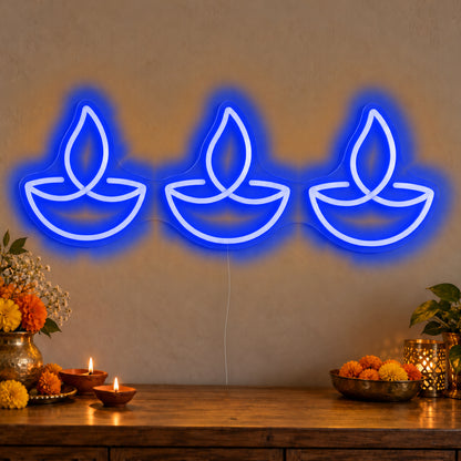 Three Diyas Neon Sign in blue LED neon on clear acrylic, angled view