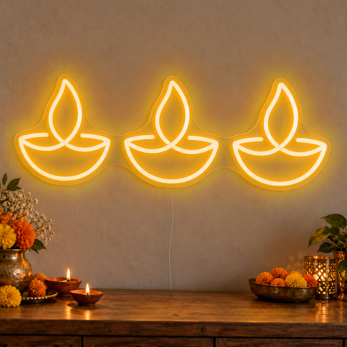 Three Diyas Neon Sign in gold LED neon on clear acrylic, angled view
