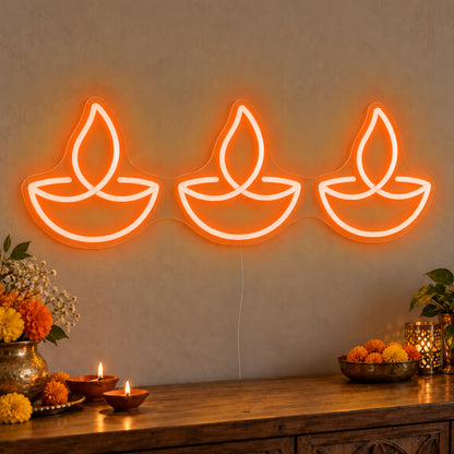Three Diyas Neon Sign in orange LED neon on clear acrylic, angled view