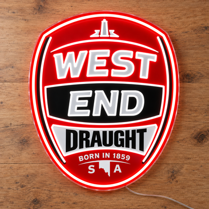 West End Draught neon sign lay flat on wooden surface