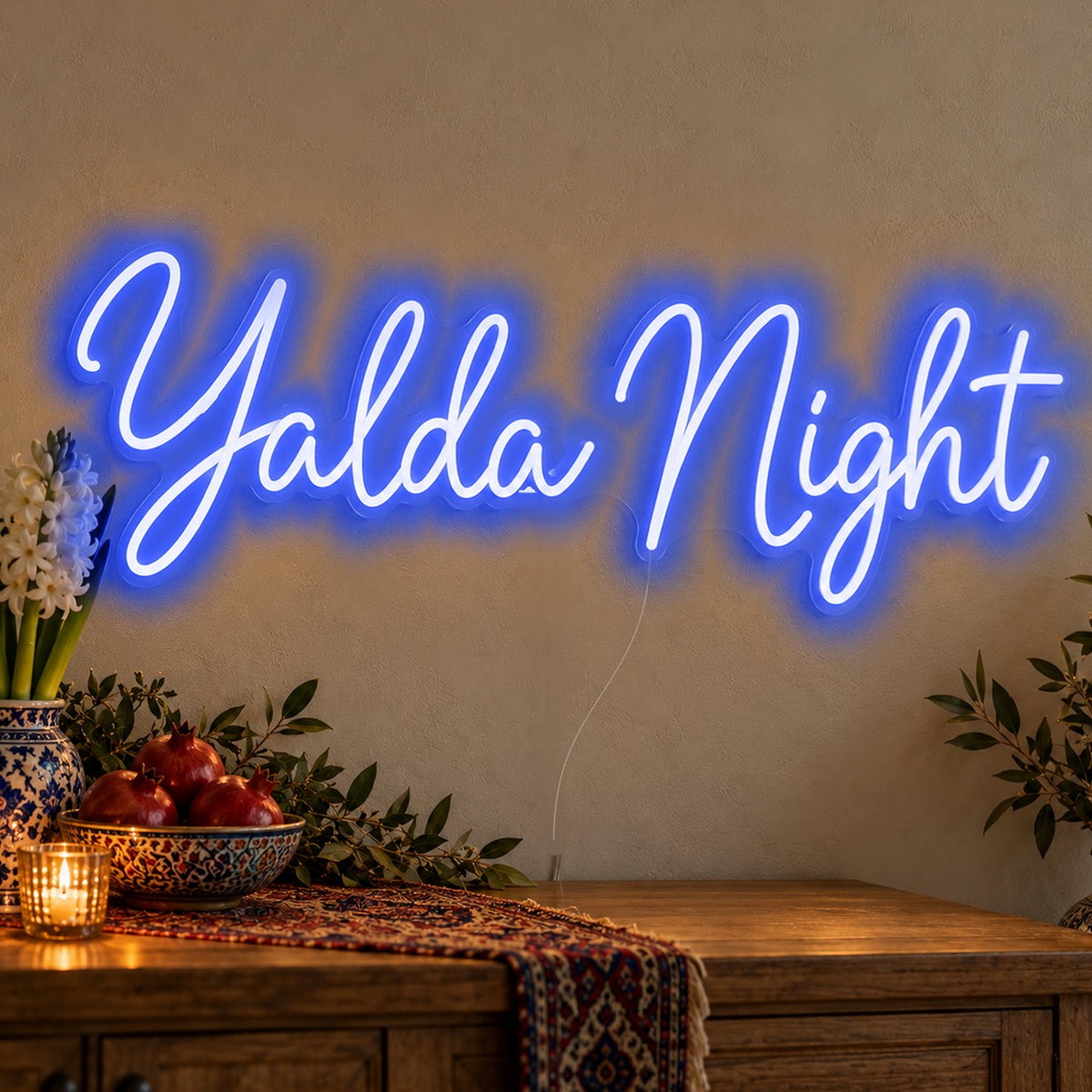 Yalda Night Neon Sign in blue LED neon on clear acrylic, angled view