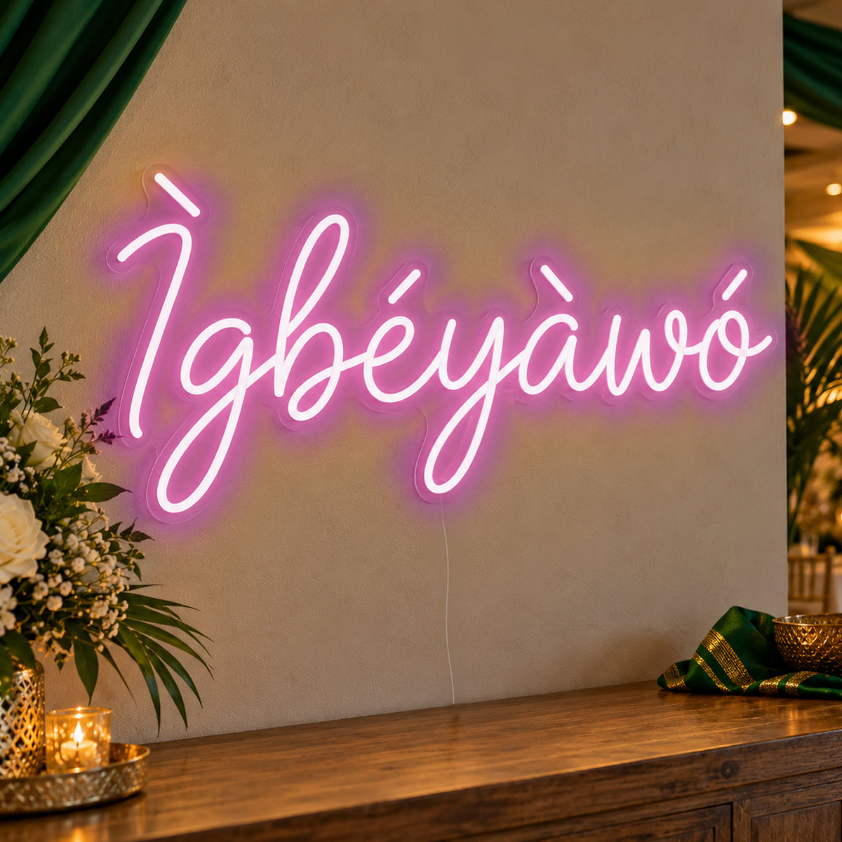 Ìgbéyàwó Yoruba Wedding Neon Sign in pink LED neon on clear acrylic, angled view
